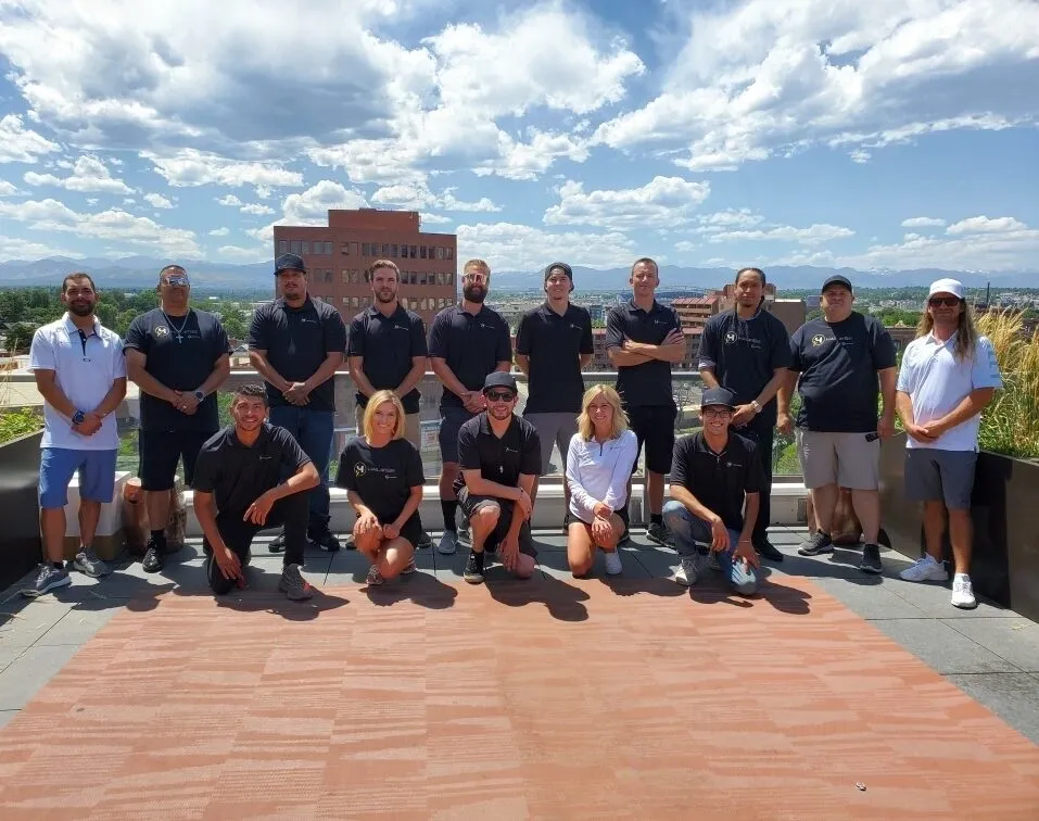 A group of people standing on top of a building.